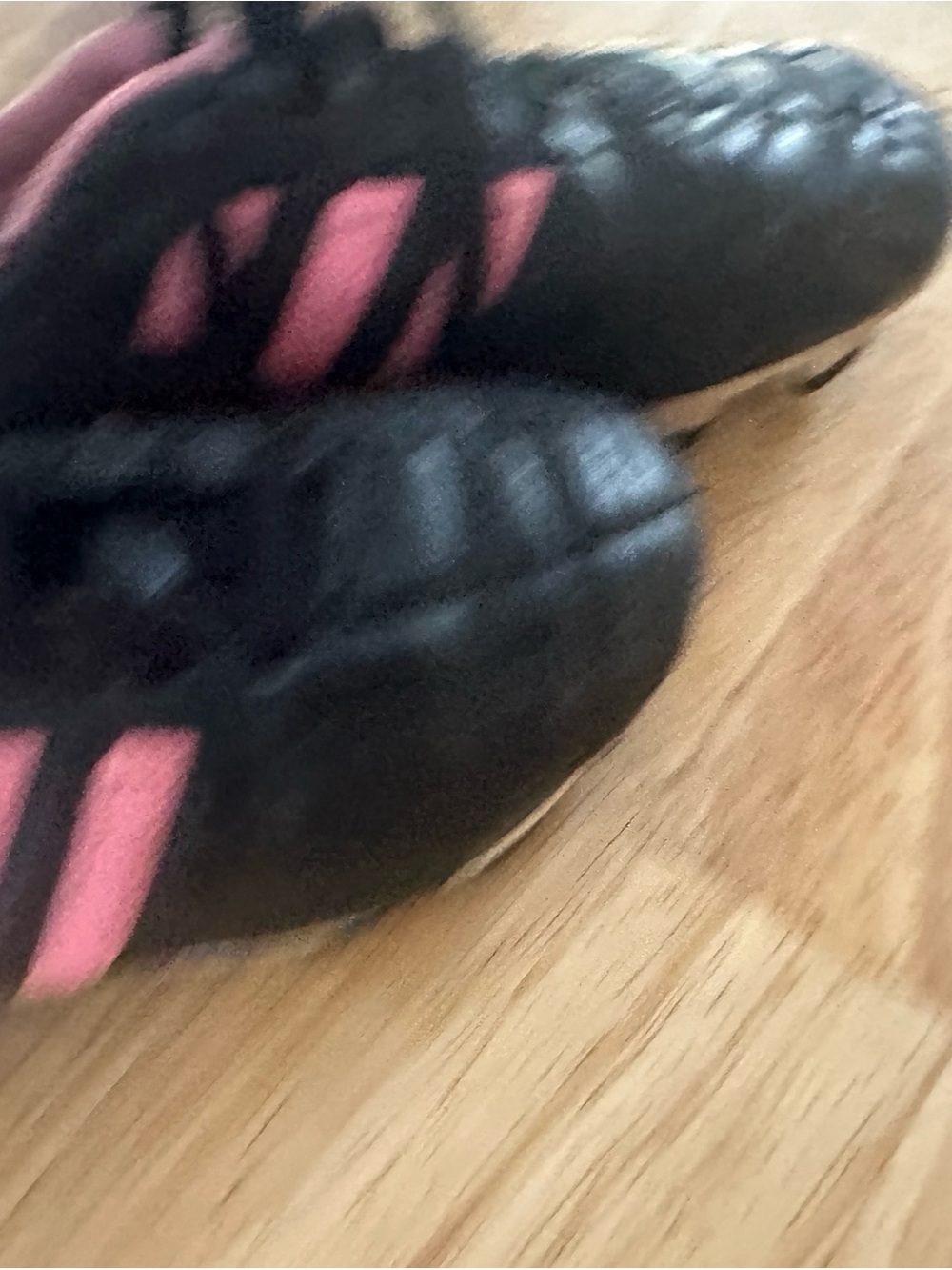Black and Pink Athletic Cleats